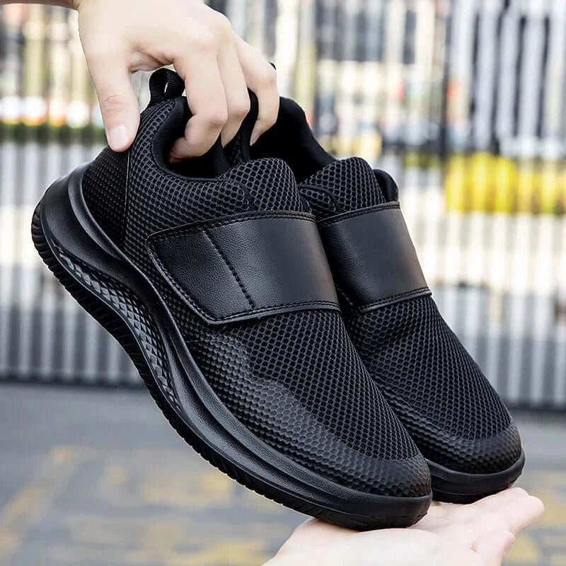 Men's black orthopedic walking shoes for wide feet with adjustable hook and loop closure.